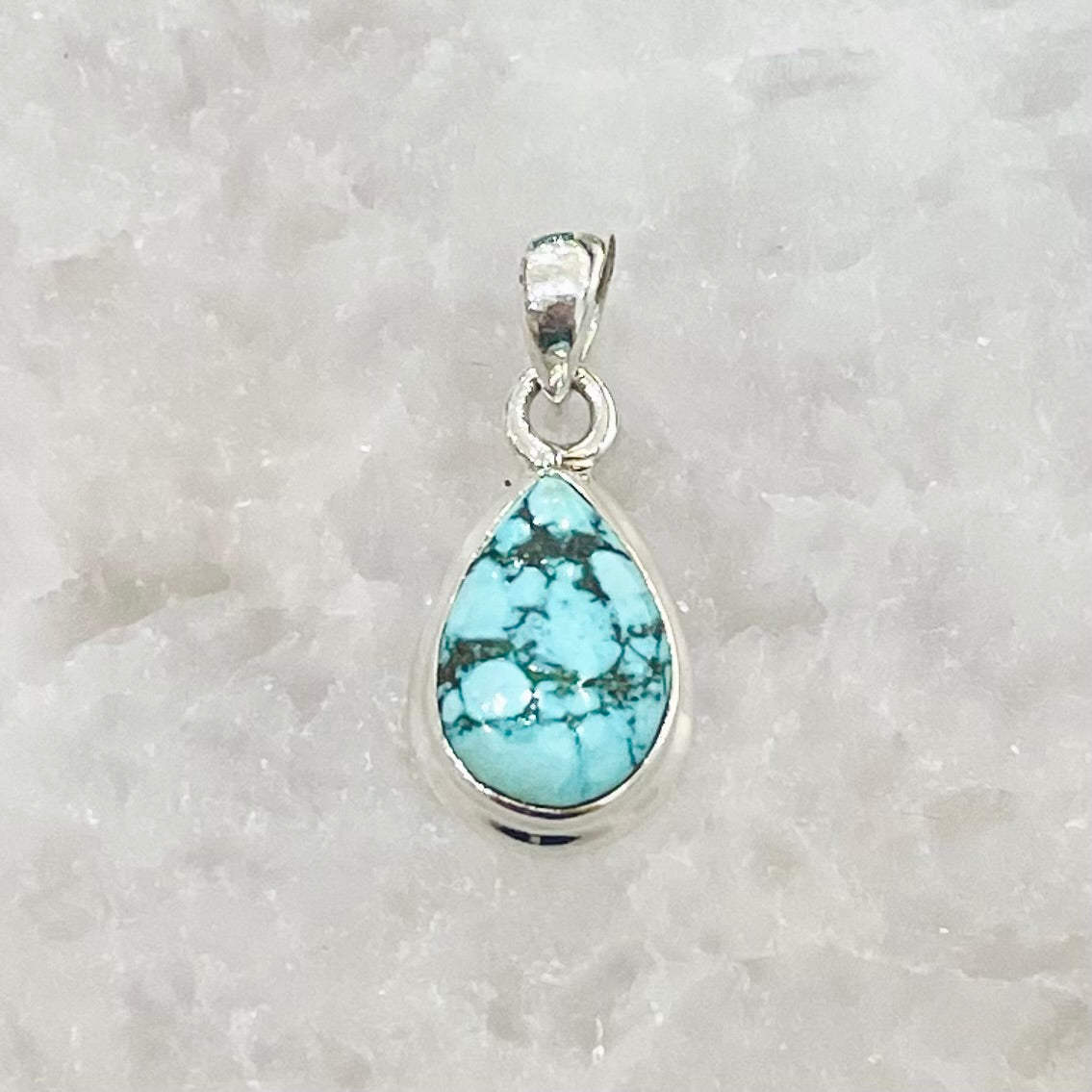 Turquoise tear drop pendant in sterling silver