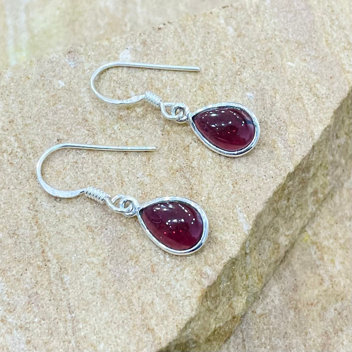 Garnet cabochon teardrop earring in sterling silver