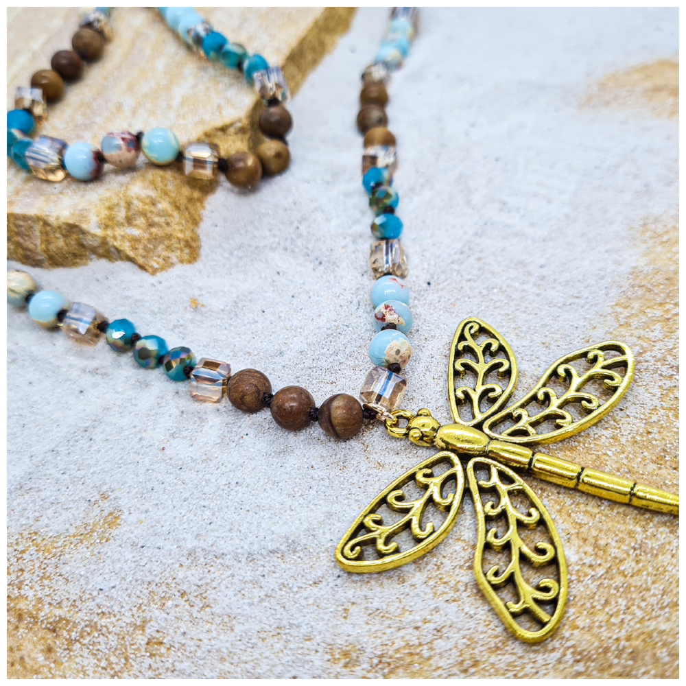 Dragonfly charm necklace with mixed crystal beads of blues and brown tones in luxury gift box