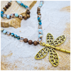 Dragonfly charm necklace with mixed crystal beads of blues and brown tones in luxury gift box