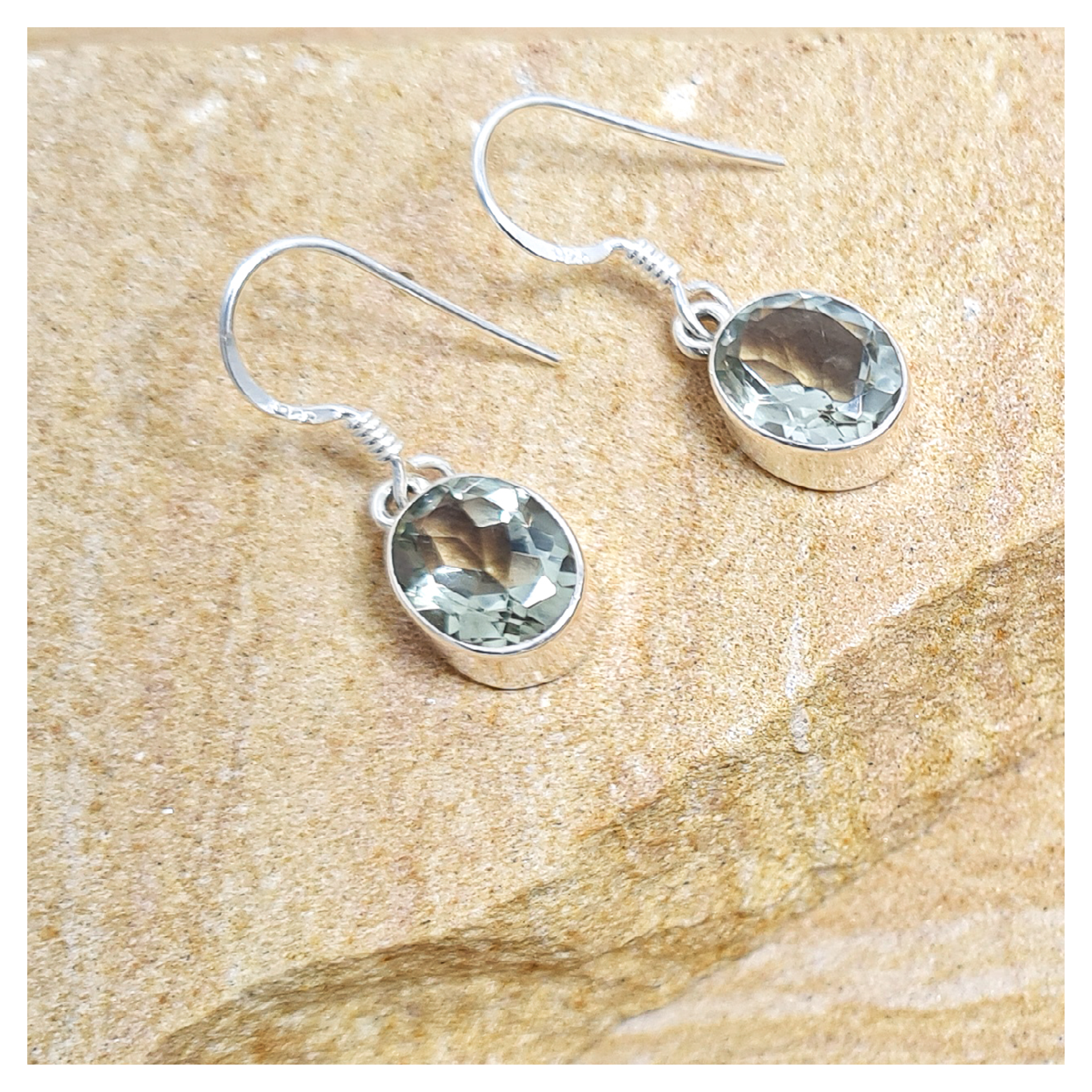 Clear quartz oval hook earrings in sterling silver