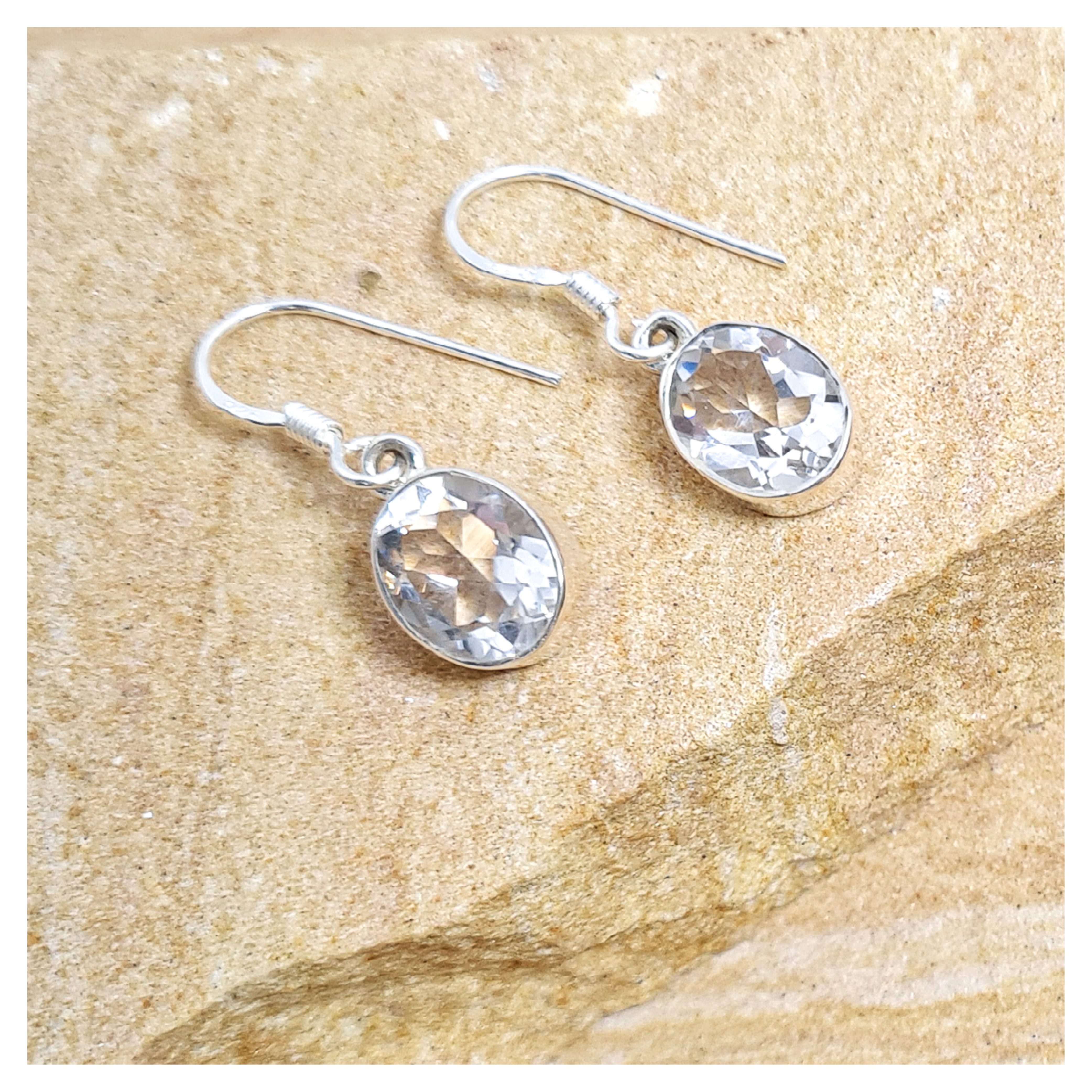 Clear quartz oval hook earrings in sterling silver