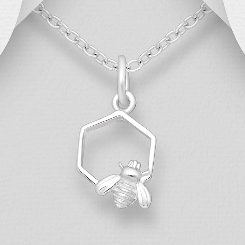 Bumblebee on honeycomb petite sterling silver pendant