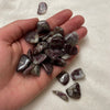 Pink tourmaline in quartz tumble stone